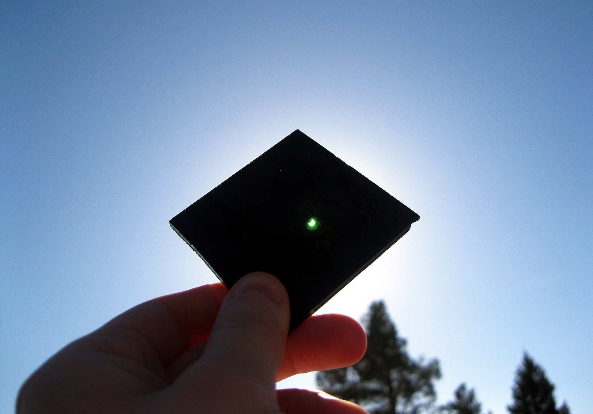 Partially eclipsed Sun seen through a shade welder's glass held at arm's length
