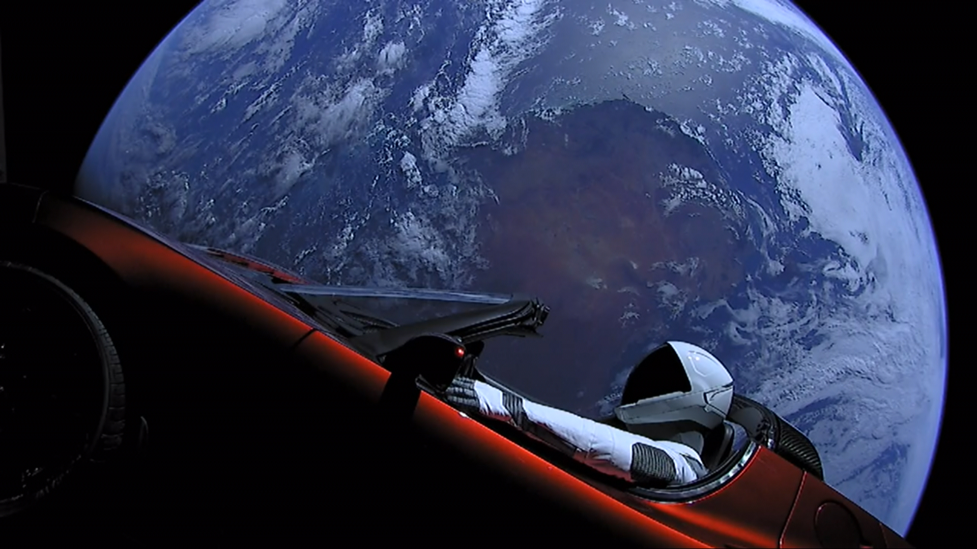 Starman driving Tesla Roadster in space